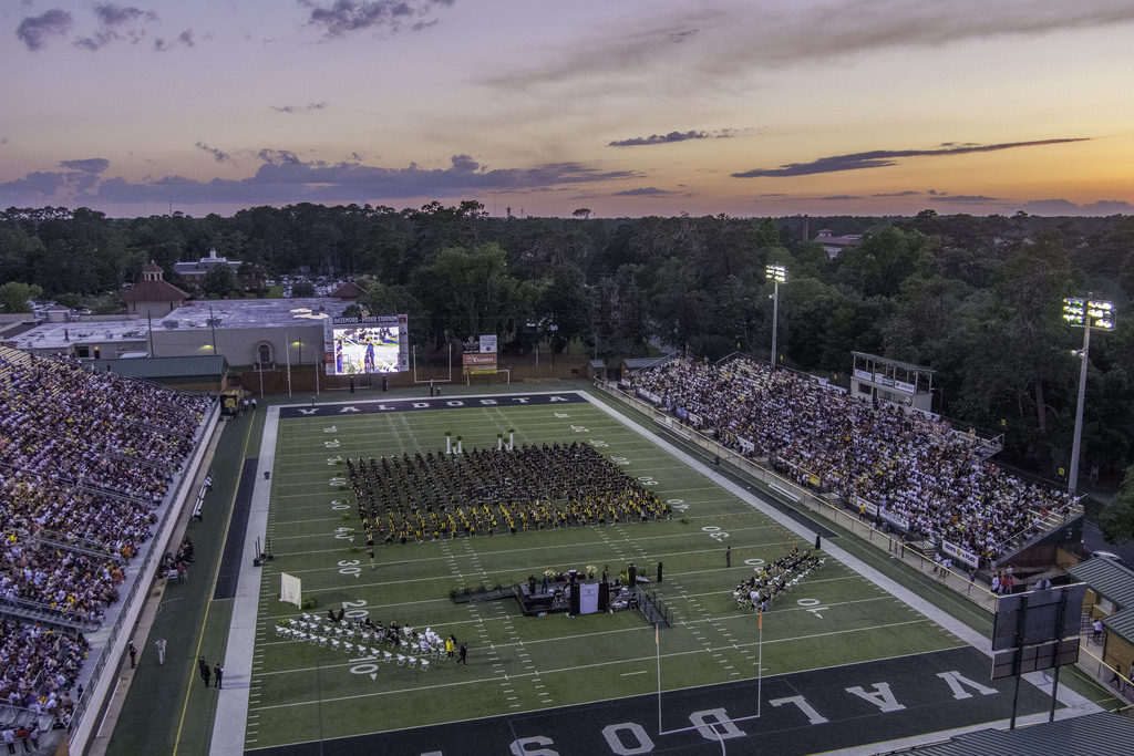 overhead view of graduating class on football field