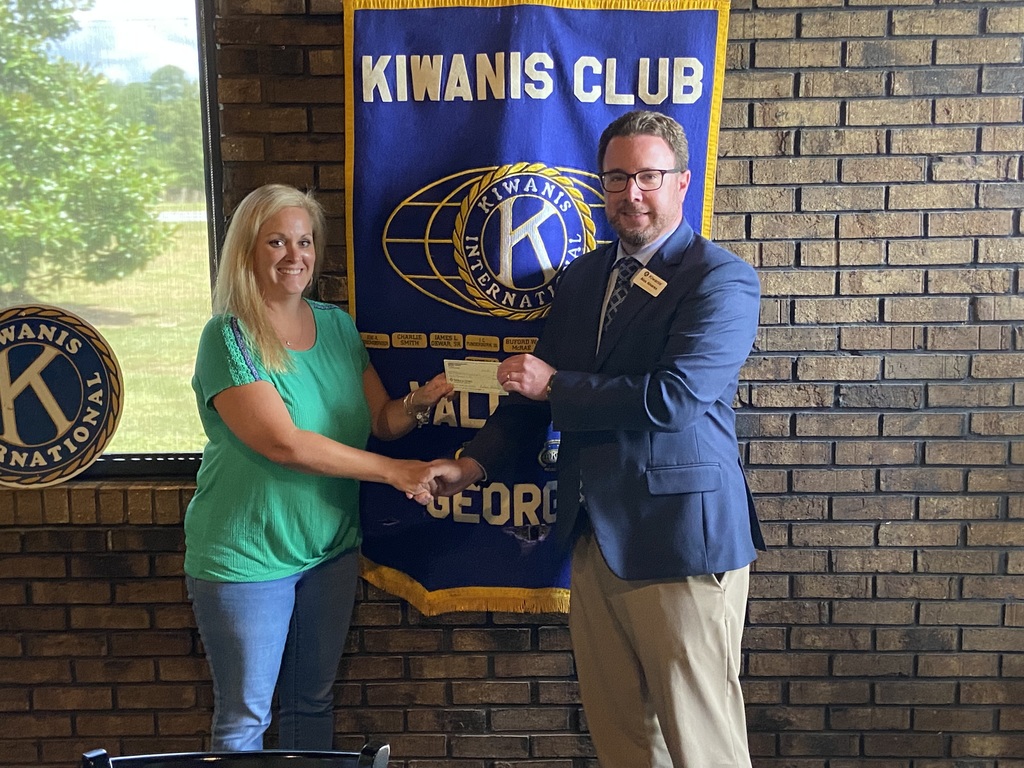 Cashwell receives donation from Kiwanis for Christmas Book Program
